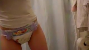 Nice Girl Stripping Off Her Pyjama Pants And Showing Nappy