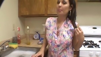 Busty Housewife Sucks In The Kitchen