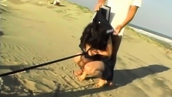 Jap School Babe Held As Sex Slave Pissing On The Beach