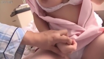 Japanese Busty Nurse Shows Her Huge Boobs To Patient
