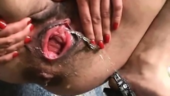 Extreme Hairy Babe Spreads Her Gaping Pissing Pussy