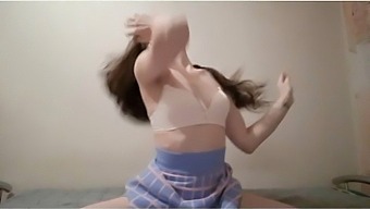 Beautiful Schoolgirl In A Skirt Is Turned On By Music