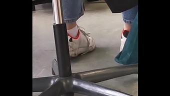 Candid Feet In White Ankle Socks And Sneakers