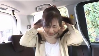 Japanese Woman Enjoys While Being Fingered In The Back Of A Car
