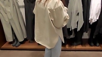 A Lecherous Female Gives A Blowjob In The Fitting Room For Some New Garments.